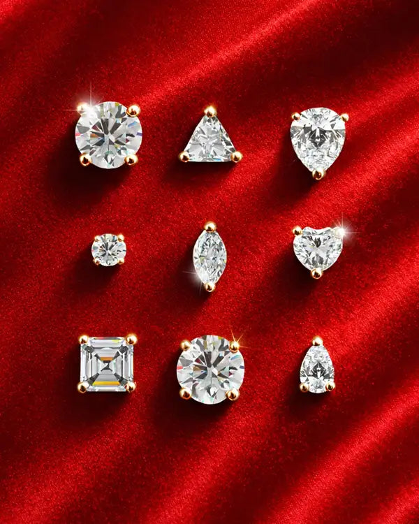 Collection of diamond studs on a red fabric background