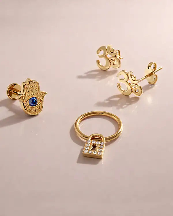 Ohm, hamsa, and lock symbol jewelry