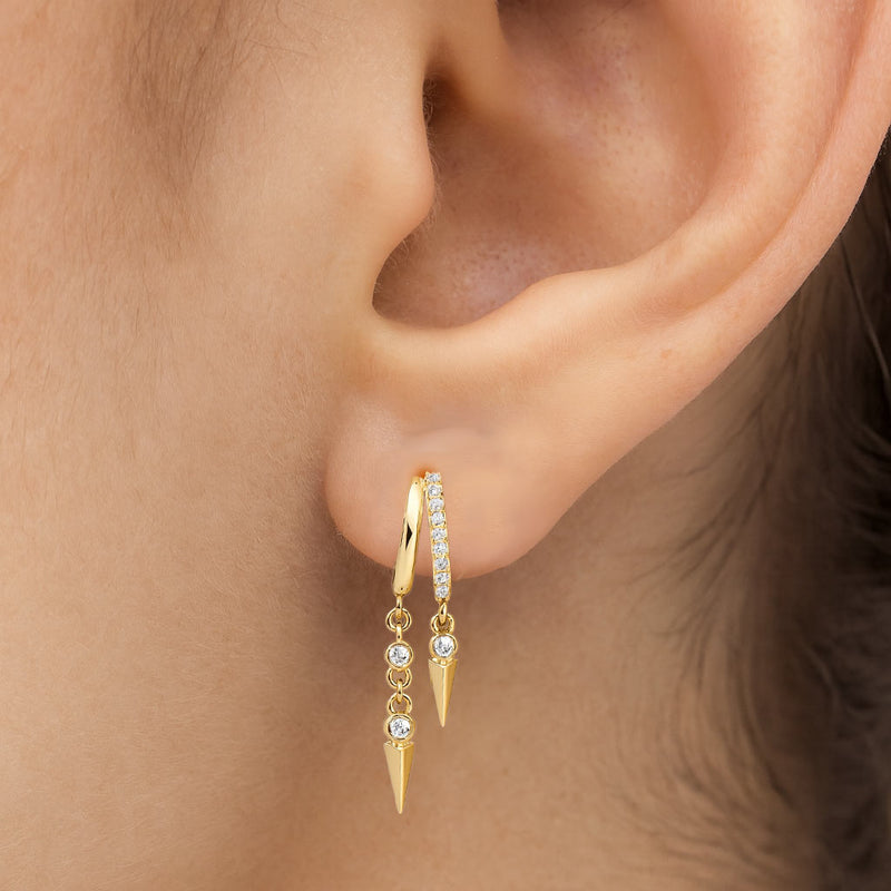 14K yellow gold Vera diamond cuff earring worn on pierced earlobe showing fit and dangle length