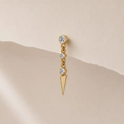 Vera Spike earring displayed on a paper background