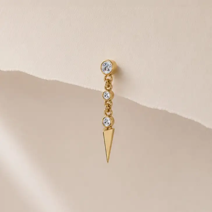 Vera Spike earring displayed on a paper background
