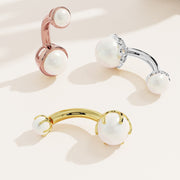Akoya pearl navel ring in three metal options: rose gold, white gold, and yellow gold side by side
