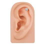 14k gold diamond cartilage stud shown in helix piercing on ear model, front-facing fit view