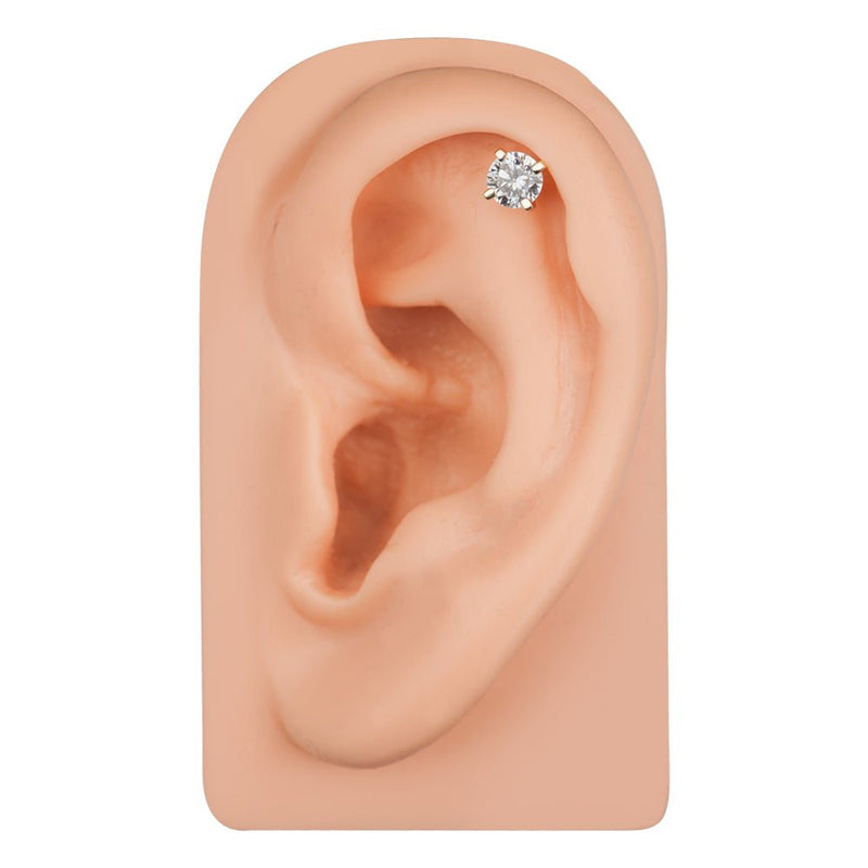 14k gold diamond cartilage stud shown in helix piercing on ear model, front-facing fit view