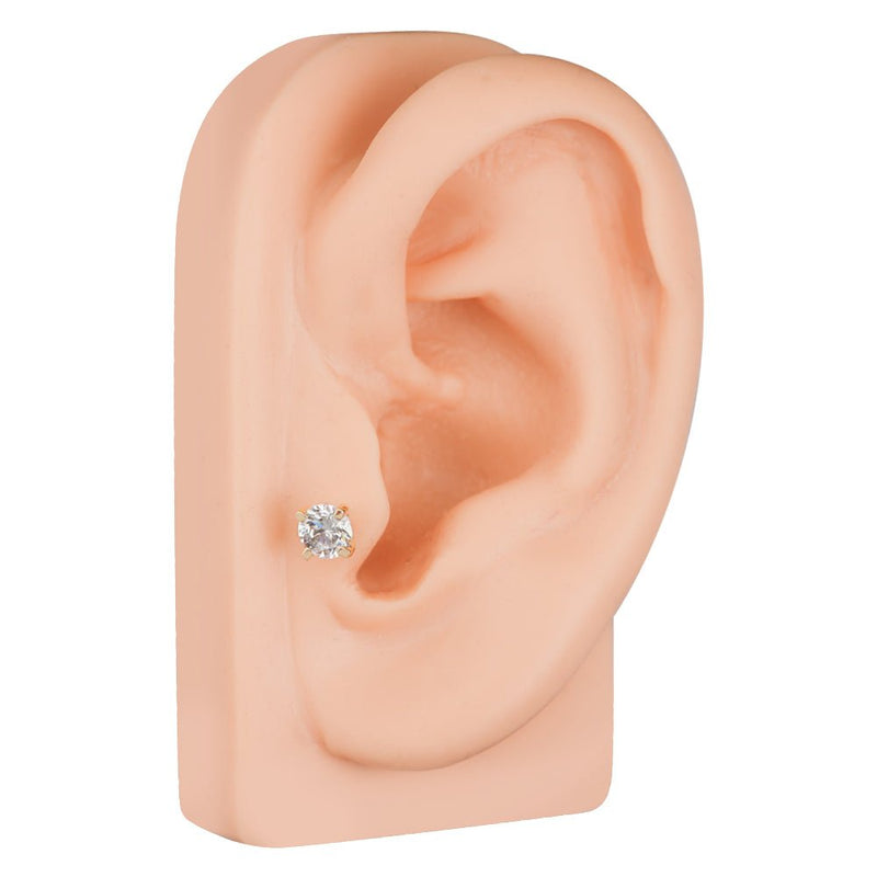 14k yellow gold diamond cartilage stud worn in lower ear lobe piercing, side profile on ear model