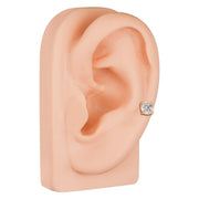 14k rose gold diamond cartilage stud shown in lobe piercing on ear model, angled side view