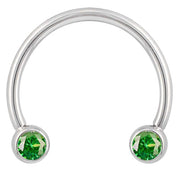 14k white gold circular barbell with green round-cut CZ bezel ends, smaller diameter front view
