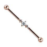14K rose gold industrial barbell with triple cubic zirconia gems, angled product view