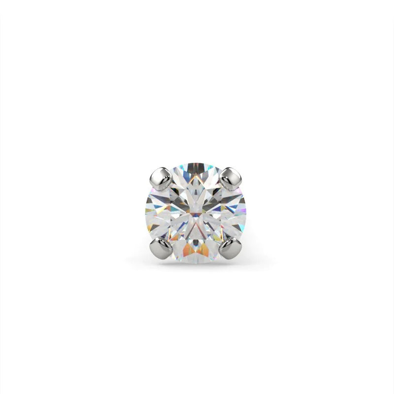 Close-up of 1.5mm round VS1 diamond in 4-prong setting, brilliant facets visible