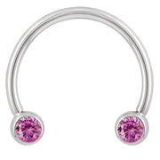 14k white gold circular barbell with pink CZ bezel ends, smaller diameter front view