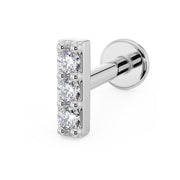 14k white gold three-diamond bar flat back labret earring, angled view with flat disc post visible