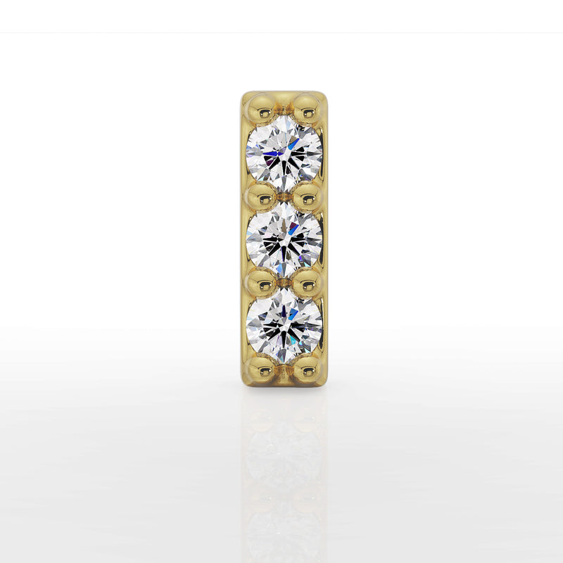 Close-up front view of 14k yellow gold diamond bar top showing three prong-set round diamonds in vertical setting