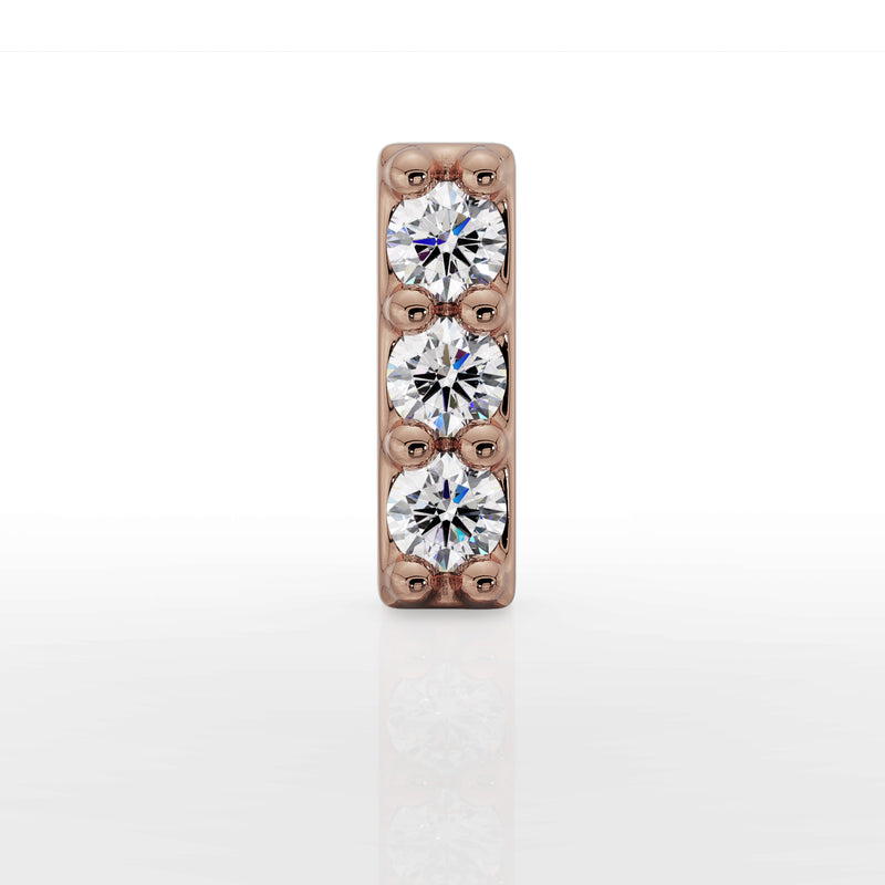Close-up front view of 14k rose gold trinity diamond bar top showing three round diamonds and prong detail