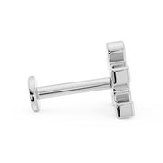 Side profile of 14K white gold puzzle piece flat back earring showing post length and flat disc back