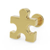 14K yellow gold puzzle piece flat back labret earring, angled 3/4 view showing post and flat disc backing
