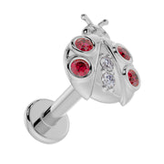 14K white gold ladybug labret stud, overhead angle showing post length and flat back disc construction