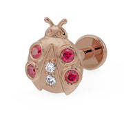 14K rose gold ladybug flat back earring with garnet and diamond accents, angled view showing disc back
