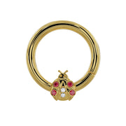 14K yellow gold ladybug seam ring with garnet and diamond stones, front view