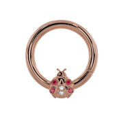 14K rose gold ladybug seam ring with garnet and diamond stones, front view