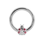 14K white gold ladybug seam ring with garnet and diamond stones, front view