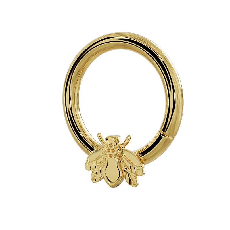 Side profile of 14K yellow gold bee seam ring showing hoop depth and bee charm placement