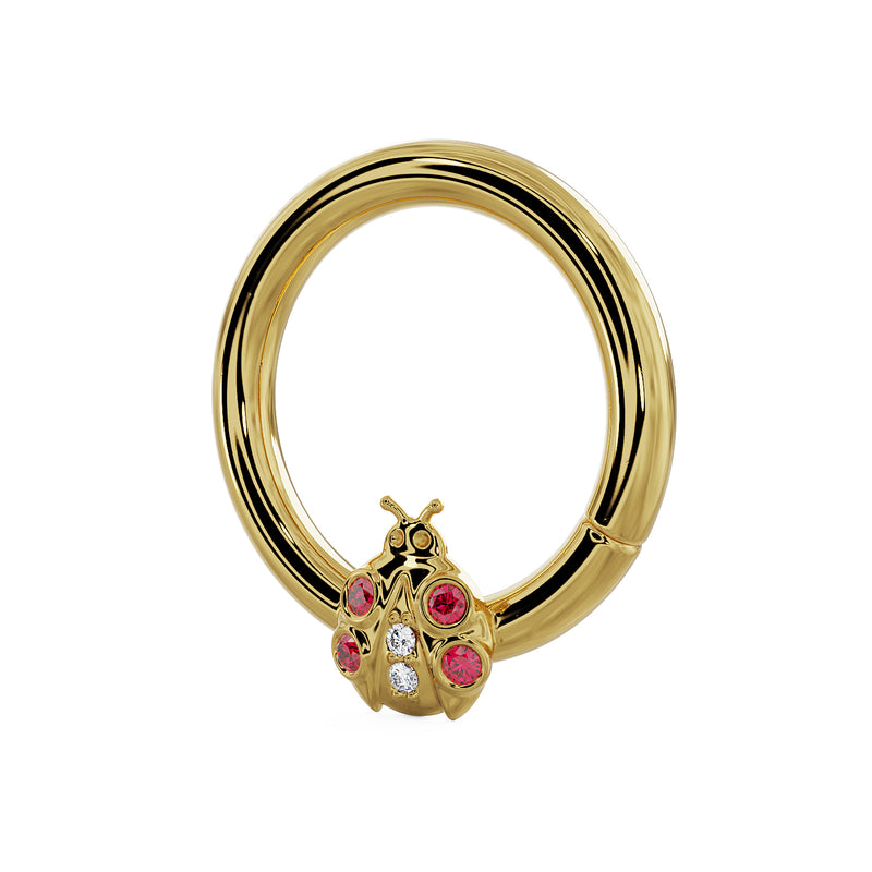 14K yellow gold ladybug seam ring with garnet and diamond accents, angled side view