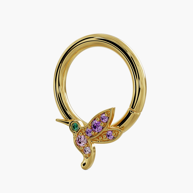 14K yellow gold hummingbird seam ring with gemstone-set wings, angled three-quarter view