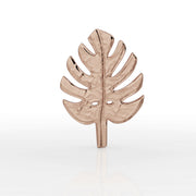 Close-up front view of 14K rose gold monstera leaf earring top showing hammered texture and cutout leaf design