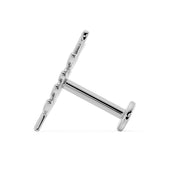 Side profile of flat back labret post showing barbell length and flat disc backing in white gold