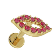 14K yellow gold lips flat back labret showing garnet pave detail and flat disc back, tilted front view