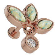 Close-up overhead view of 14K rose gold opal wildflower labret highlighting iridescent opal petals and CZ dangle
