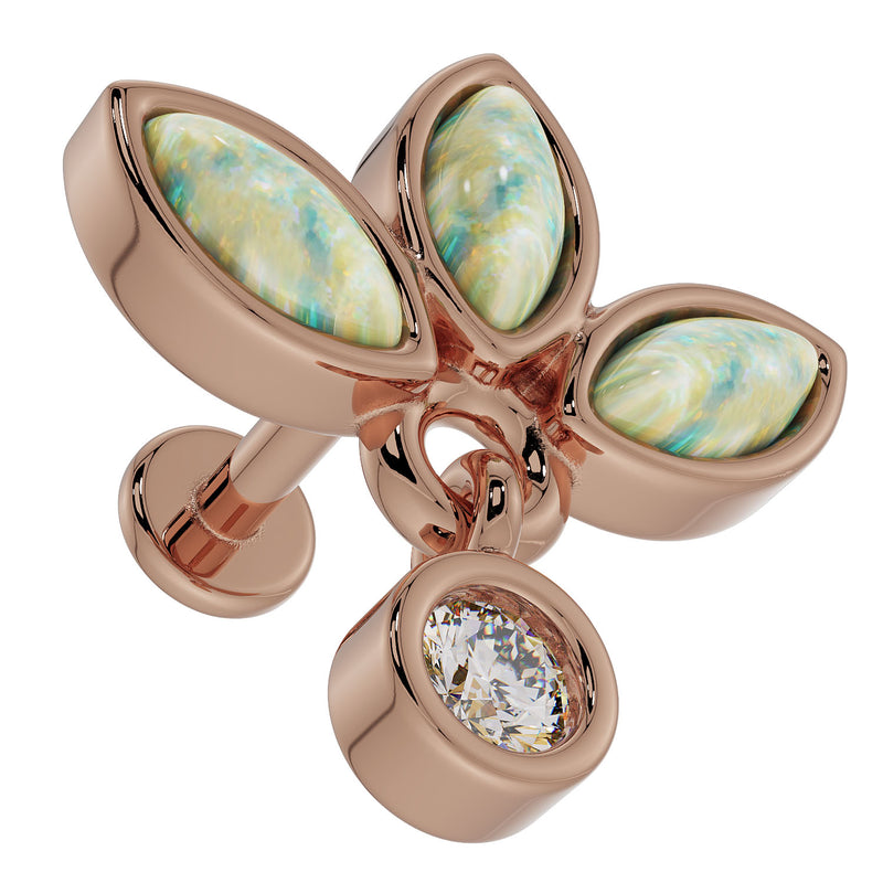 Close-up overhead view of 14K rose gold opal wildflower labret highlighting iridescent opal petals and CZ dangle