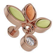 Close-up of 14K rose gold wildflower labret showing jade and coral petal settings and dangling diamond charm