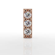 Close-up front view of 14k rose gold milgrain bar top with three brilliant-cut diamonds, direct front