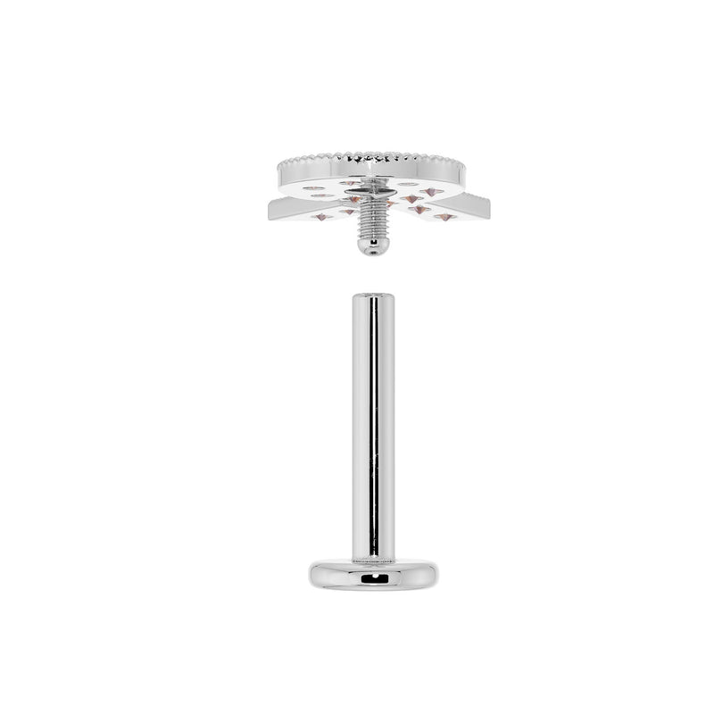 Exploded view of flat back labret showing threaded top and post with flat disc, illustrating assembly