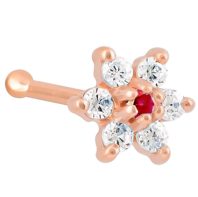 14K rose gold CZ flower nose bone with red ruby CZ center stone, angled view on white background