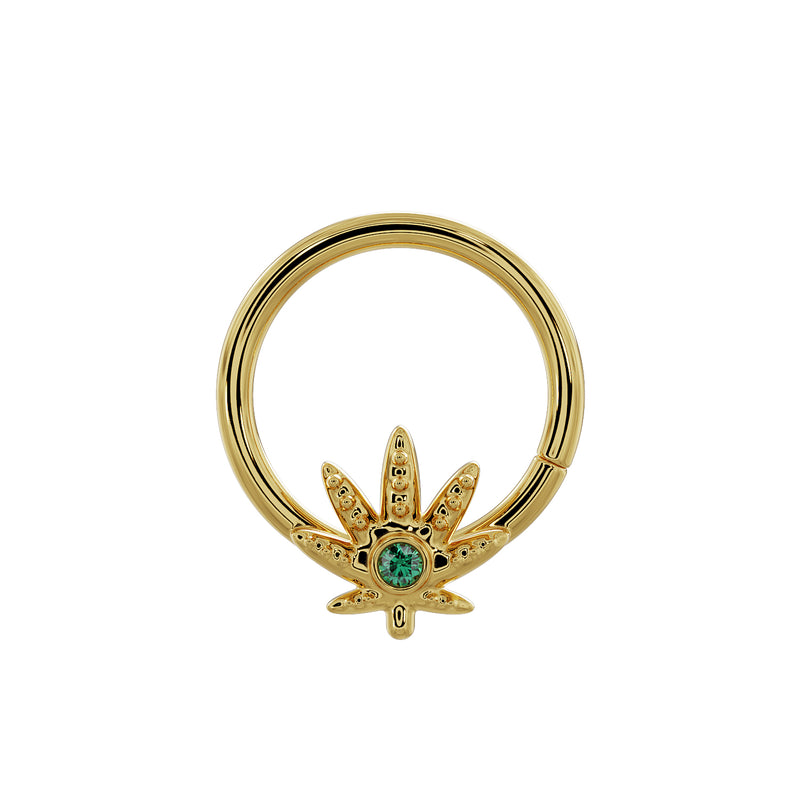 Close-up front view of 14K yellow gold pot leaf seamless ring highlighting emerald center stone