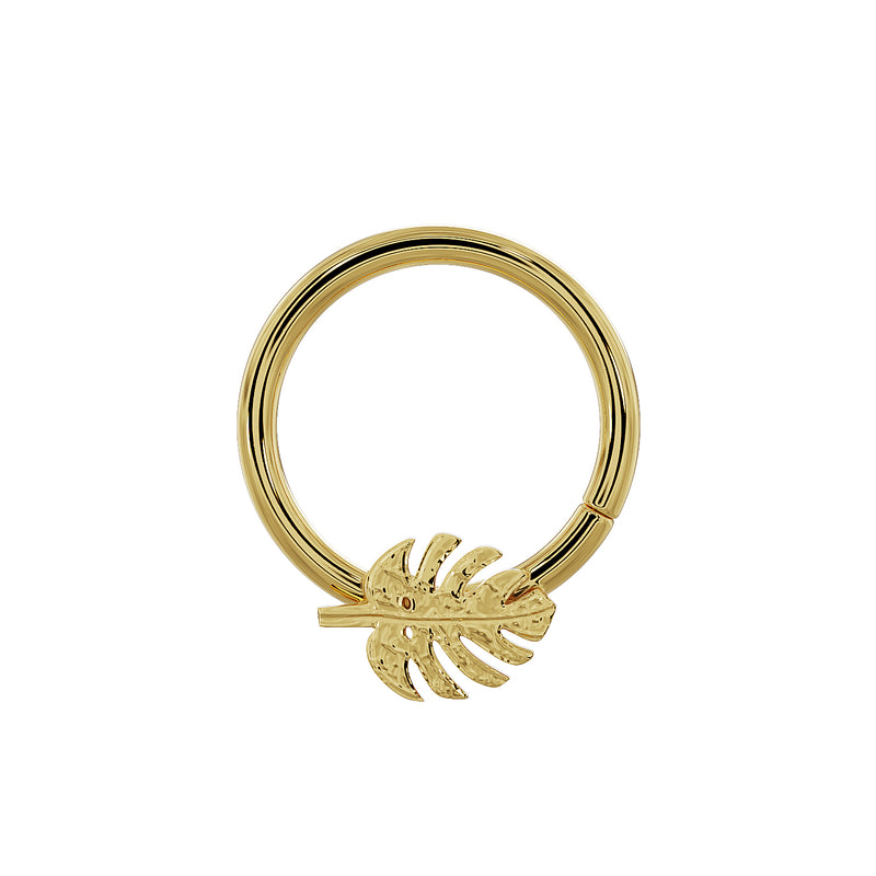 14K yellow gold monstera seam ring with leaf charm positioned at bottom center, slightly larger diameter view