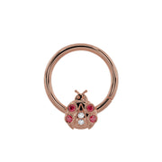 14K rose gold ladybug seam ring, larger diameter view highlighting garnet and diamond charm detail