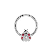 14K white gold ladybug seam ring, larger diameter showing polished hoop and gem-set ladybug charm