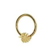 Side-angled view of 14K yellow gold monstera leaf seam ring showing hoop depth and leaf charm relief