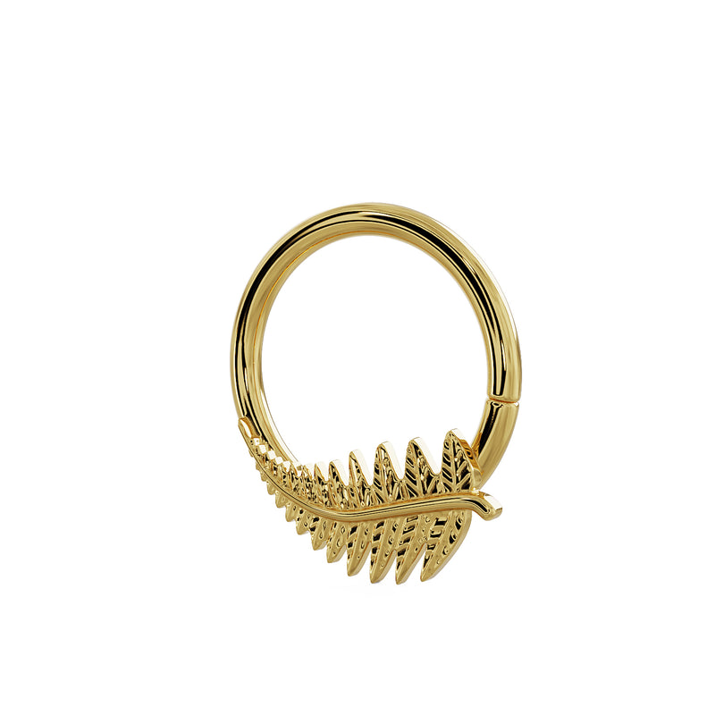 Side-angled view of 14K yellow gold fern leaf seam ring showing engraved leaflets and ring depth