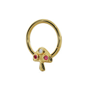 Side-angled view of 14K yellow gold mushroom seam ring showing depth of bezel-set ruby and diamond