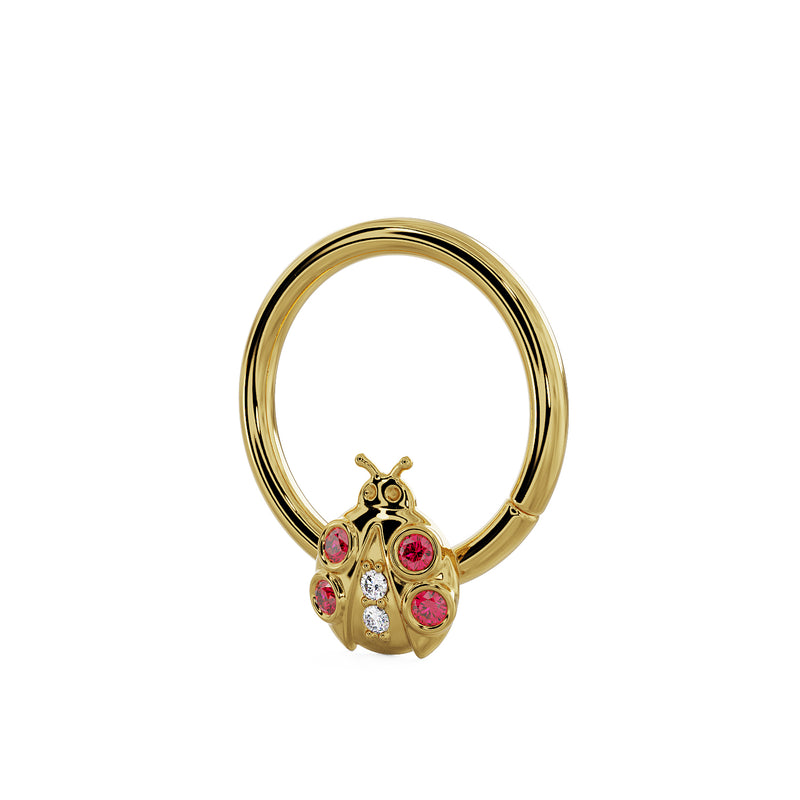 14K yellow gold ladybug seam ring, angled view showing garnet and diamond charm from a slight angle