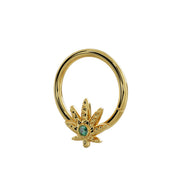 Side-angled view of 14K yellow gold pot leaf seamless hoop showing leaf charm from lower angle
