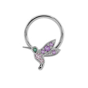 14K white gold hummingbird seam ring angled left, showing emerald eye and amethyst wing stones