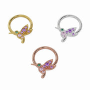 Hummingbird seam ring in 14K yellow, white, and rose gold shown together in angled close-up view