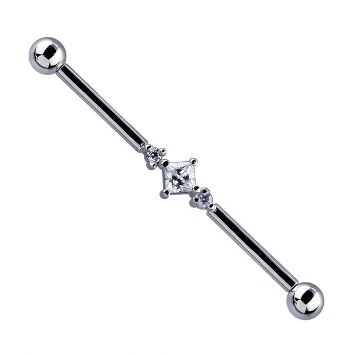 14K white gold industrial barbell with triple CZ setting — princess cut center flanked by two round stones
