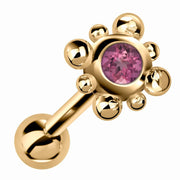 14k yellow gold beaded bezel cartilage stud with pink tourmaline gemstone, angled view