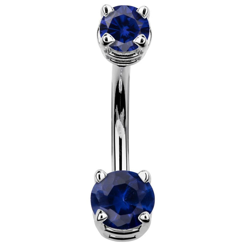 14k white gold navel ring with deep blue CZ stones in prong settings, front view